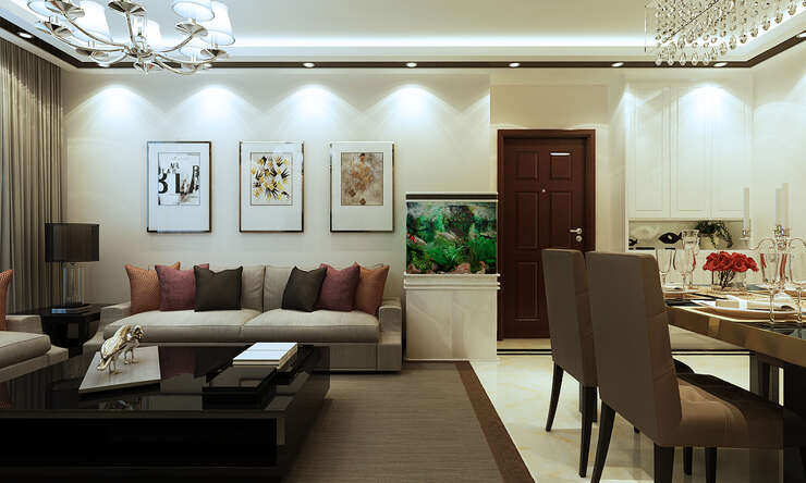 沙发背景简单，装饰画凸显空间氛围，鱼缸的引入增加了空间的灵动性